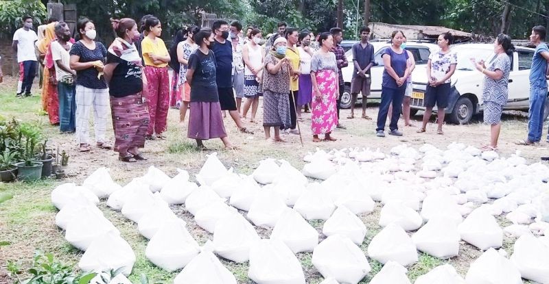 Northeast Sewa Mission members distributing dry rations items to the needy in Purana Bazaar, Dimapur.